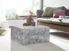 Couchtisch MONOBLOC 60x30x60cm Hochglanz Marmoroptik Weiß Quadratisch in Gesamtansicht vor einem Sofa mit Dekoration. Anteprima dell’immagine prodotto