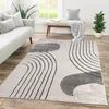 A modern living room with a sofa, rug, and bench. Produktbild-Vorschau