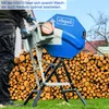 A person is using a log saw in an outdoor setting with a large pile of logs in the background. Náhľad obrázku produktu