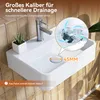 A white ceramic sink with a faucet and a small plant, with an inset showing water draining. Náhled obrázku produktu