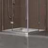 A close-up view of a modern shower tray with glass enclosure and brown tiled walls. Produktbild-Vorschau
