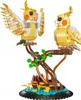 A Lego-style model of two cockatiels perched on a tree branch. Náhľad obrázku produktu