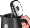 A hand is shown opening the lid of a black electric kettle. Náhľad obrázku produktu