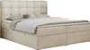 A beige boxspring bed with two storage drawers and a tufted headboard, shown from a side-angle. Produktbild-Vorschau