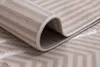 A close-up view of a rolled-up rug with a striped pattern. Produktbild-Vorschau