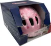 A pink children's helmet with flower patterns inside a blue cardboard box. Produktbild-Vorschau
