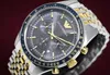 A close-up shot of an Emporio Armani chronograph watch with a two-tone metal band. Produktbild-Vorschau