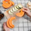 A person is preparing food by slicing vegetables and placing them into vacuum seal bags. Náhľad obrázku produktu