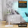 A white stand fan is shown in a living room setting with a couch in the background. Blue air circulation graphics are overlaid on the image. Voir les images du produit
