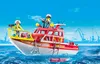 A red and white fire rescue boat with two figures on board, sailing on blue water with a harbor and cranes in the background. Produktbild-Vorschau