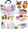 A collection of items for needle felting, including wool roving, tools, and finished felted figures. Produktbild-Vorschau