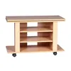 A light wood-colored TV stand with shelves and wheels, shown against a white background. Podgląd zdjęcia produktu