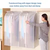 A woman is closing the zipper on a translucent garment bag hanging on a closet rod. Clothes are visible inside the bag. Produktbild-Vorschau