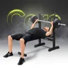 A man is performing a bench press exercise on a black weight bench with a barbell. Náhled obrázku produktu
