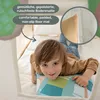 A young child is lying on a padded floor mat inside a play tent. Náhled obrázku produktu