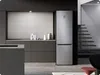 A modern kitchen with a Samsung refrigerator, counter, and stairs in the background. Náhled obrázku produktu