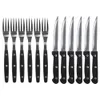 A set of steak knives and forks arranged neatly on a white background. Produktbild-Vorschau
