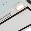 A close-up view of the control panel and light of a kitchen range hood. Náhľad obrázku produktu