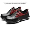 A pair of black and red safety shoes shown from a diagonal angle against a white background. Produktbild-Vorschau