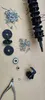 Various parts and tools are laid out on a brown surface. Anteprima dell’immagine prodotto