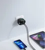 A white wall with a white electrical outlet, a black charger plugged into the outlet, and two electronic devices (a smartphone and a tablet) charging. Podgląd zdjęcia produktu