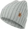 A close-up studio shot of a knitted beanie.