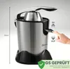 A close-up shot of a stainless steel electric citrus juicer with a hand pressing a lever. Náhľad obrázku produktu