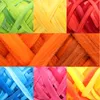 A collage of nine close-up images of colorful wool roving. Produktbild-Vorschau