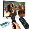 A television displaying a scene with people in traditional attire, with two remote controls and a product tag in the foreground. Voir les images du produit