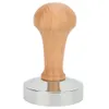 A coffee tamper with a wooden handle and a silver base, isolated on a white background. Náhled obrázku produktu