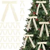 A collection of beige velvet bows arranged on a white background, with a Christmas tree decorated with similar bows in the background. Voir les images du produit