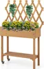 A wooden planter box with a trellis and plants, set against a white background. Produktbild-Vorschau
