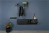 A modern entryway with a shoe cabinet, coat rack, and decorative items. Produktbild-Vorschau
