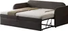 A dark gray sofa bed is shown in its extended bed form, with bedding laid out. Anteprima dell’immagine prodotto