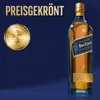 A bottle of Johnnie Walker Blue Label whisky is shown against a dark blue background, with promotional text and an award badge. Produktbild-Vorschau