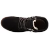 A top-down view of a black boot with white fur lining. Voir les images du produit