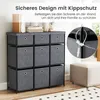 A grey fabric dresser with nine drawers is shown, with a close-up inset of a safety strap attached to the dresser and a wall anchor. Anteprima dell’immagine prodotto