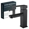 A black faucet is shown next to its packaging. Podgląd zdjęcia produktu