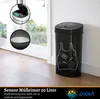 A black sensor trash can with a drawing of a shopping bag filled with groceries is shown next to a doorway. Inset images show the sensor mechanism and a close-up of the trash can's interior. Náhľad obrázku produktu