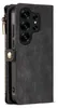 A close-up side view of a black leather wallet-style phone case with a zipper and a snap closure, showing the camera cutout of a phone inside. Produktbild-Vorschau
