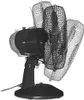 A black table fan with a silver motor casing is shown in a studio setting against a white background. The fan has three mesh guards, with the front guard appearing in focus and the other two slightly blurred and angled to suggest movement. The fan is mount Produktbild-Vorschau