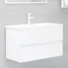 A white bathroom vanity with a sink and faucet mounted on a gray tiled wall. Produktbild-Vorschau