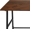 Close-up view of a desk with a dark wood top and black metal legs. Náhled obrázku produktu