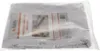 A Christmas tablecloth is folded and packaged in a clear plastic bag with a label. Náhľad obrázku produktu