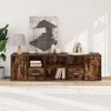 A wooden media console with various compartments, drawers, and shelves, decorated with a painting and some decorative objects. Náhľad obrázku produktu