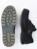 A pair of black Ecco Track 25 men's shoes are shown from a top-down view, with one shoe displayed sole-up and the other side-up. Produktbild-Vorschau
