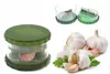 A collage of a garlic press and fresh garlic bulbs. Produktbild-Vorschau