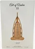 The image shows the packaging of a perfume bottle, featuring a stylized representation of a building. Voir les images du produit