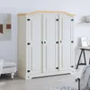 A white wardrobe with a wooden top is shown in a room setting. Voir les images du produit