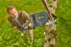 A man is using a Gardena telescopic tree pruner to cut a branch from a tree in a grassy garden. Produktbild-Vorschau
